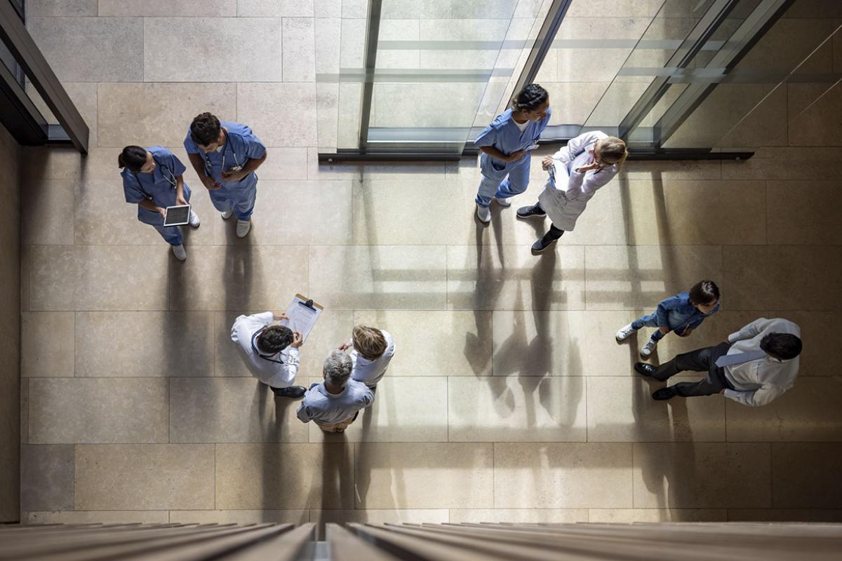 Overhead shot of health professionals in lobby of hospital or health center